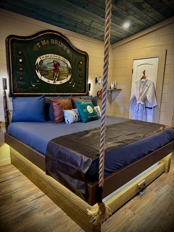 ROPE SUSPENDED KING BED - SECRET ROLL OUT QUEEN UNDERNEATH - LUXURY LINENS ARE PROVIDED