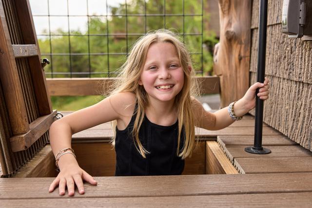 POP OUT OF THE ESCAPE HATCH ON THE UPPER DECK AND CATCH THE 20-FOOT SLIDE DOWN