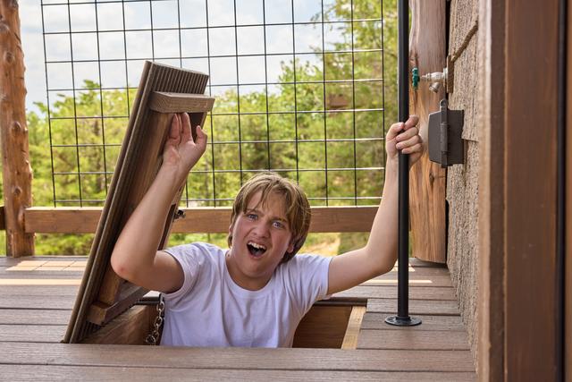 POP THROUGH THE ESCAPE HATCH ON THE UPPER DECK AND CATCH THE 20-FOOT SLIDE DOWN