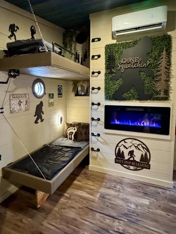 SET OF DOUBLE BUNKS - LED FIREPLACE - USB PORTS - PORT HOLE WINDOWS - READING LIGHTS - LOWER BUNK CRANKS UP TO REVEAL A TABLE TOP FOR TWO - LUXURY LINENS AND SLEEPING BAGS PROVIDED