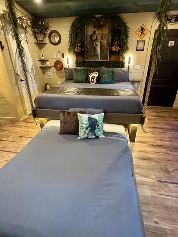 KING BED WITH A SECRET ROLL OUT QUEEN UNDERNEATH - CRANK THE WHEEL ON THE WALL TO REVEAL AN INTERACTIVE FEATURE - LUXURY LINENS PROVIDED