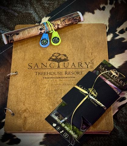 CHECK - IN PACKET - MAP AND COMPASSES - AND YOUR TREEHOUSE BOOK WITH INFORMATION TO MAKE YOUR STAY MORE COMFORTABLE