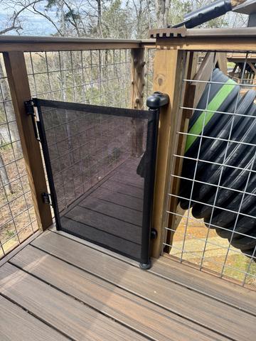 FOR SAFETY WE HAVE INSTALLED A BABY GATE TO BLOCK ACCESS TO THE 20-FOOT SLIDE ON THE UPPER DECK