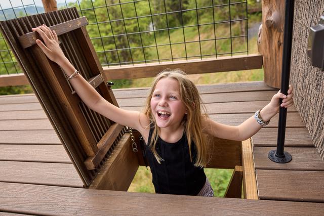 POP THROUGH THE ESCAPE HATCH ON THE UPPER DECK AND CATCH THE 20-FOOT SLIDE DOWN