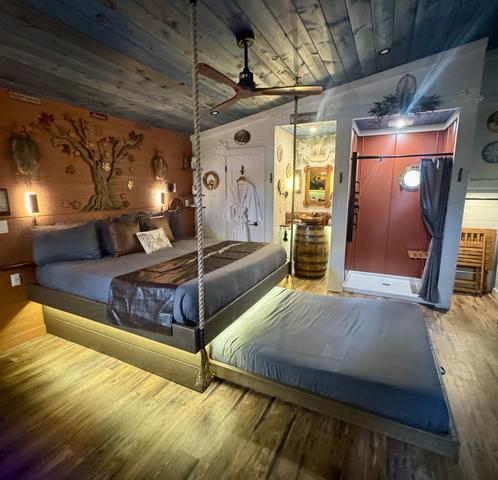 ROPE SUSPENDED KING BED - SECRET ROLL OUT QUEEN BED - TURN THE WHEEL ON THE WALL AND REVEAL A COMFY QUEEN BED OR A COUCH - LUXURY BEDDING PROVIDED