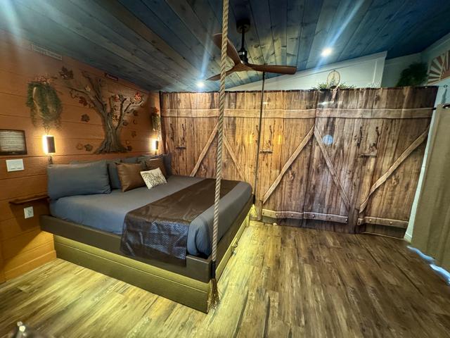 FOR PRIVACY, WE HAVE ADDED A ROOM DIVIDER CURTAIN TO CLOSE OFF THE BATHROOM AND SHOWER AREA