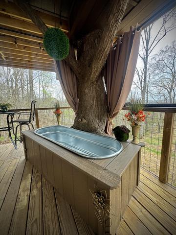 OUTDOOR SOAKING TUB ON LOWER DECK - PRIVACY CURTAINS - BISTRO LIGHTING - OUTDOOR TABLE TOP SEATING FOR 2 - DRINK CHUTE EXIT