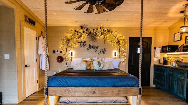 ROPE SUSPENDED KING BED - HONEY HOLE LUXE TREEHOUSE - SLEEPS UP TO 4 - SANCTUARY TREEHOUSE RESORT IN THE SMOKY MOUNTAINS