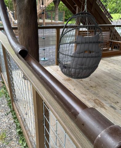 LOWER DECK DRINK CHUTE EXIT AT AMONG THE WILDFLOWERS TREEHOUSE - SANCTUARY TREEHOUSE RESORT IN THE SMOKY MOUNTAINS