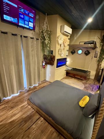 SECRET ROLL OUT QUEEN BED - 50" TV - FRENCH DOORS TO THE UPPER DECK