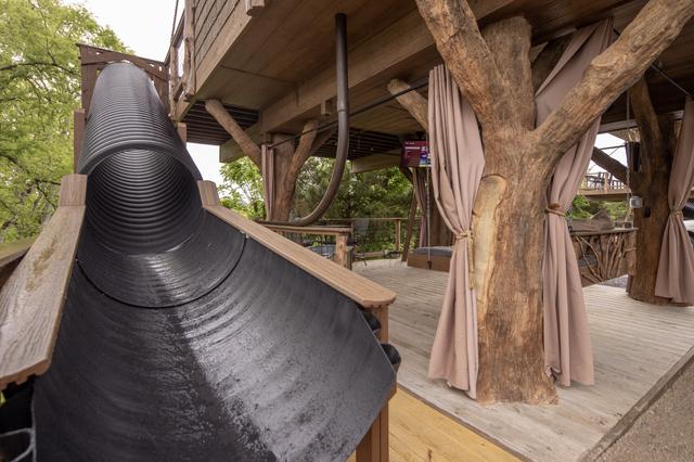 TAKE A TRIP DOWN THE 20-FOOT SLIDE AT HONEY HOLE LUXE TREEHOUSE