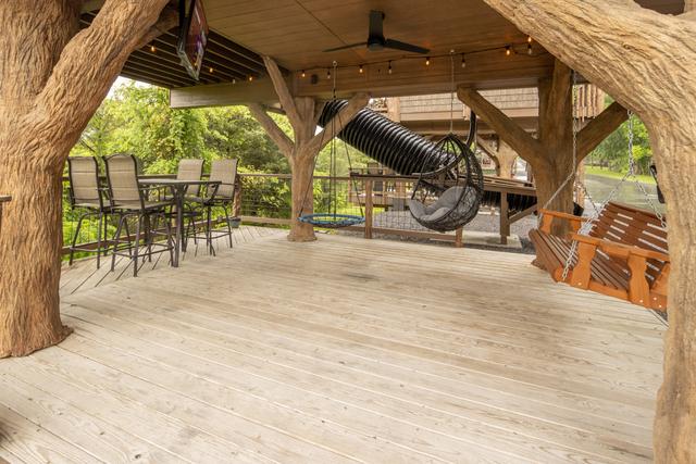 2 LOWER DECKS - SWINGS - 2 ROPE CLIMBS - 2 ESCAPE HATCHES - 2 SECRET LADDERS - TWO 20-FOOT SLIDES - TWO 50" TV'S - 2 DRINK CHUTES AND MORE