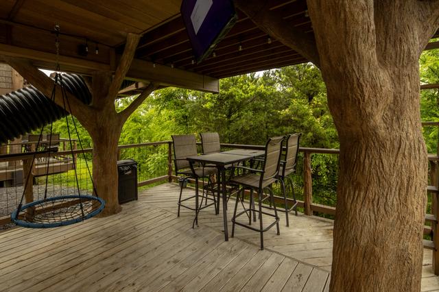 2 LOWER DECKS - SWINGS - 2 ROPE CLIMBS - 2 ESCAPE HATCHES - 2 SECRET LADDERS - TWO 20-FOOT SLIDES - TWO 50" TV'S - 2 DRINK CHUTES AND MORE