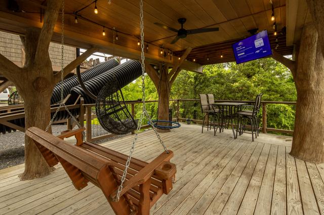 2 LOWER DECKS - SWINGS - 2 ROPE CLIMBS - 2 ESCAPE HATCHES - 2 SECRET LADDERS - TWO 20-FOOT SLIDES - TWO 50" TV'S - 2 DRINK CHUTES AND MORE