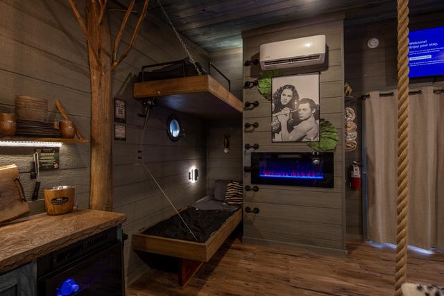 2 SETS OF DOUBLE BUNKS - 2 LED FIREPLACES - CRANK THE LOWER BUNK FOR INTERACTIVE FEATURE - LUXURY LINENS & SLEEPING BAGS PROVIDED