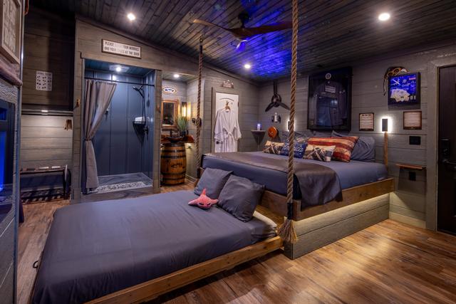 TURN THE WHEEL ON THE WALL AND REVEAL A SECRET ROLL OUT QUEEN BED - LUXURY LINENS PROVIDED