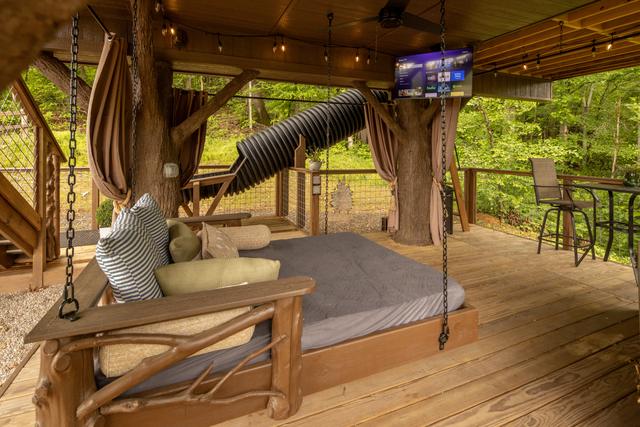 LOWER DECK - OUTDOOR DAY BED SWING - 50" TV - DRINK CHUTE - SECRET LADDER - BISTRO LIGHTS - PRIVACY CURTAINS - 20-FOOT SLIDE