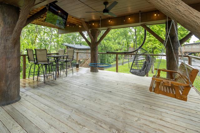LOWER DECK WITH ALL OF OUR INTERACTIVE CUSTOM FEATURES ONLY AT SANCTUARY TREEHOUSE RESORT IN THE SMOKIES