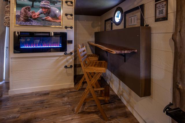 CRANK UP THE LOWER BUNK TO REVEAL A TABLE TOP FOR TWO WITH TWO BAR STOOLS - EXTRA DINING OR WORK SPACE