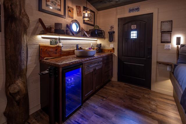 KITCHENETTE - MICROWAVE - MINI FRIDGE - KEURIG COFFEE MAKER + K-CUPS - SERVICE WARE - CLEANING/COOKING SUPPLIES - TELESCOPE - SPEAK EASY FRONT DOOR - DRINK CHUTE - FIRST AID KIT - AND MORE...
