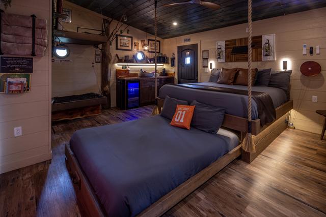 ROLL OUT SECRET QUEEN BED - TURN THE INTERACTIVE FEATURE WHEEL - LUXURY LINENS PROVIDED