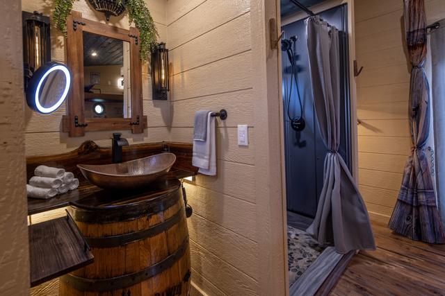 CUSTOM JACK DANIELS' WHISKEY BARREL SINK - MAGNIFYING MIRROR - HAIR DRYER - LUXURY LINENS AND TOILETRIES ARE PROVIDED