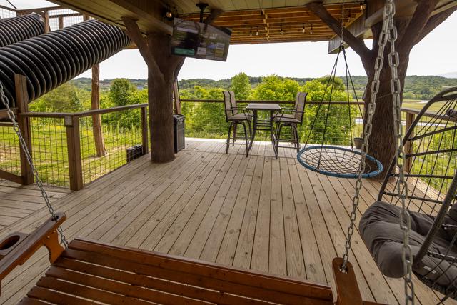 LOWER DECK - LAND OF THE FREE - HOME OF THE BRAVE - TREEFORT DOUBLE TREEHOUSES AT SANCTUARY TREEHOUSE RESORT IN THE SMOKIES!