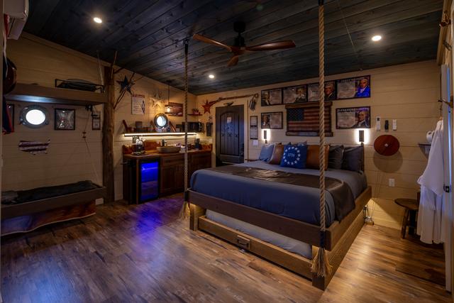 ROPE SUSPENDED KING BED WITH SECRET ROLL OUT QUEEN BED - KITCHENETTE - SPEAK EASY FRONT DOOR