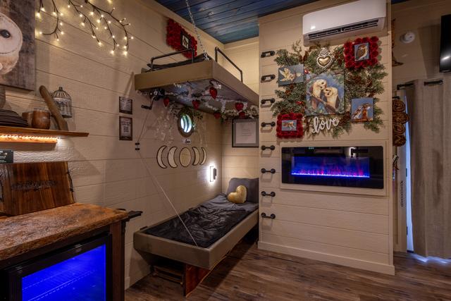 DOUBLE BUNKS - LED FIREPLACE - READING LIGHTS - USB PORTS - PORT HOLE WINDOW - LOWER BUNK CRANKS UP TO REVEAL A TABLE TOP FOR 2
