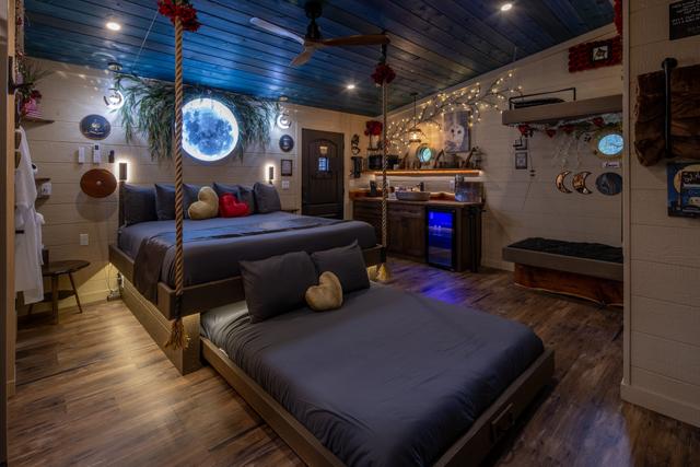 ROPE SUSPENDED KING BED WITH A SECRET ROLL OUT QUEEN BED - STAR PROJECTOR LIGHT - LUXURY BEDDING IS PROVIDED