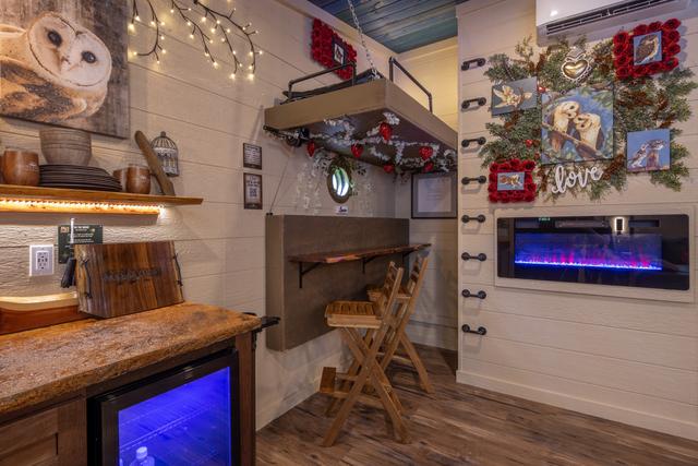 CRANK THE LOWER BUNK UP TO REVEAL A TABLE TOP AND SEATING FOR TWO FOR ADDED INDOOR DINING OR WORK SPACE