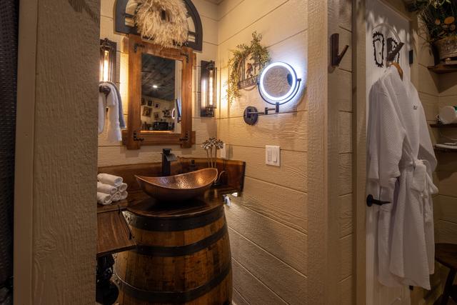 CUSTOM JACK DANIELS' WHISKEY BARREL SINK VANITY - MAGNIFYING MIRROR - LUXURY LINENS AND TOILETRIES ARE PROVIDED