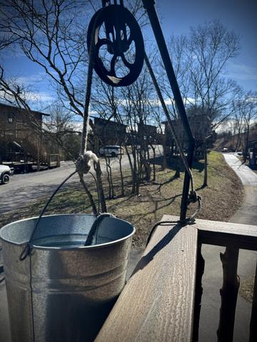 RAISE AND LOWER ANY SIZE CAN OR BOTTLE BETWEEN DECKS WITH THE BUCKET PULLEY
