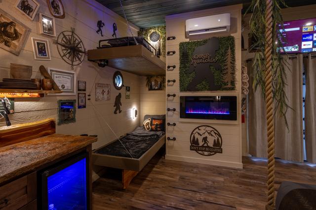 SET OF DOUBLE BUNKS - LED FIREPLACE - USB PORTS - PORT HOLE WINDOWS - READING LIGHTS - LOWER BUNK CRANKS UP TO REVEAL A TABLE TOP FOR TWO - LUXURY LINENS AND SLEEPING BAGS PROVIDED