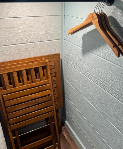 CLOSET WITH BAMBOO HANGERS - LUGGAGE RACK FOR SUIT CASES - COLLAPSIBLE TABLE TOP WITH TWO CHAIRS FOR EXTRA SEATING