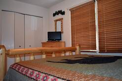 74 Life's a Bear Retreat guest bedroom with queen bed and Cable TV