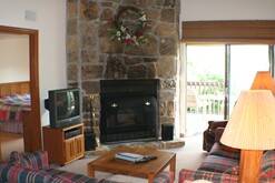Enjoy the wood burning fireplace at your Gatlinburg condo rental.