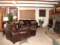 living room with large tv with dvd/vcr and gas fireplace