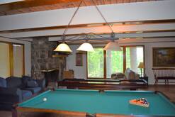 game room with pool table, shuffle board, woodburning fireplace, tv with cable