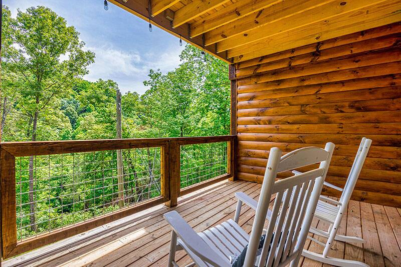 Enjoy the sunset from your porch covered rockers. at Big Splash Lodge in Gatlinburg TN