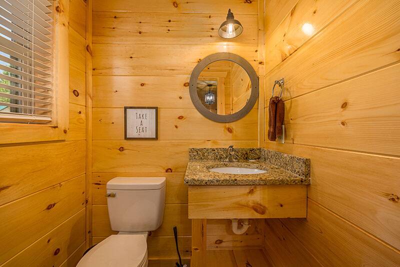 One of the bathrooms in your cabin. at Big Splash Lodge in Gatlinburg TN