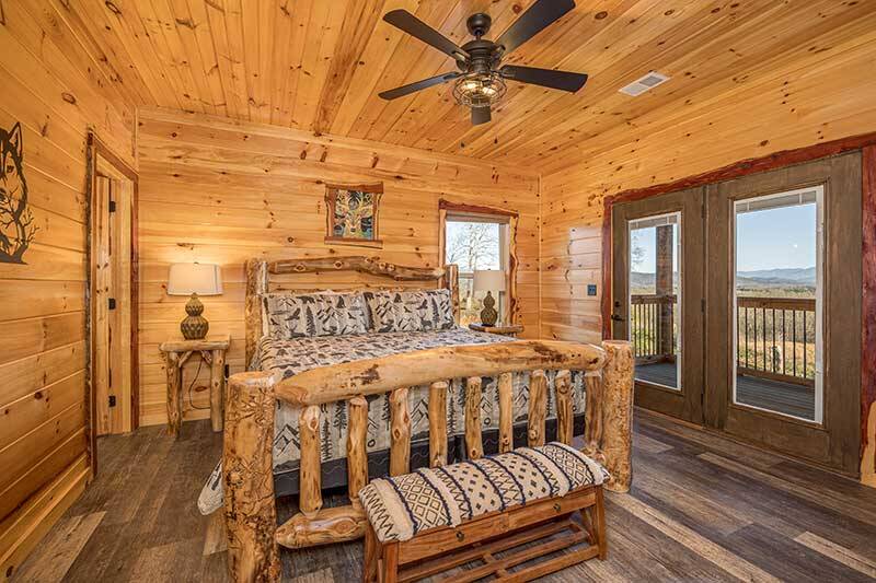 Smokies cabin's second bedroom with log bed. at Sunset Peak in Gatlinburg TN
