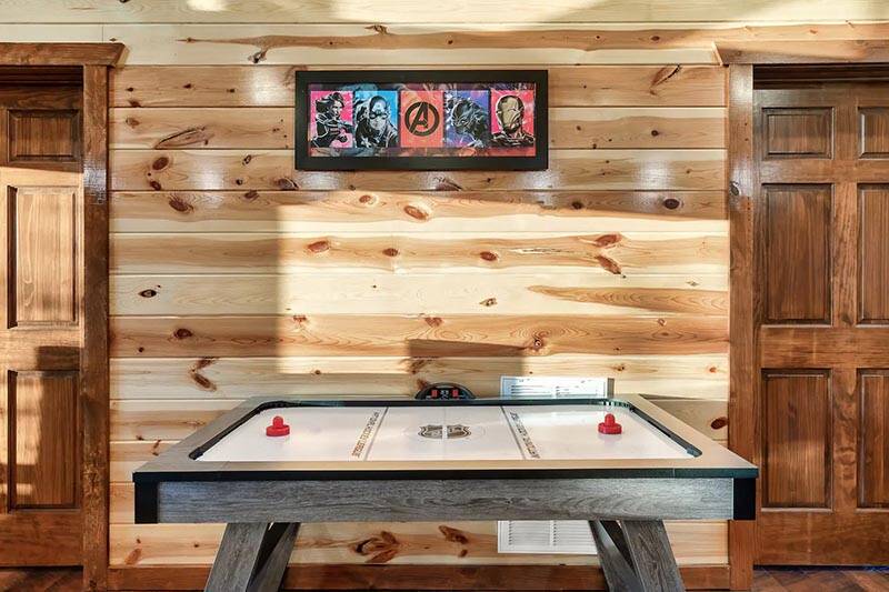 Family members can enjoy free games of air hockey. at Cabin Fever Vacation in Gatlinburg TN