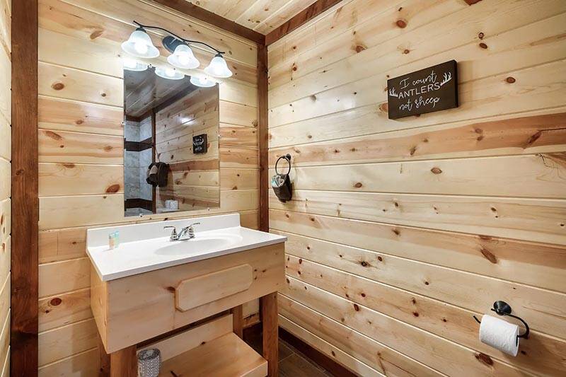 Sink in your cabin's first bath. at Cabin Fever Vacation in Gatlinburg TN