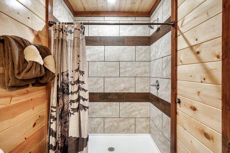 Shower in your cabin's first bath. at Cabin Fever Vacation in Gatlinburg TN