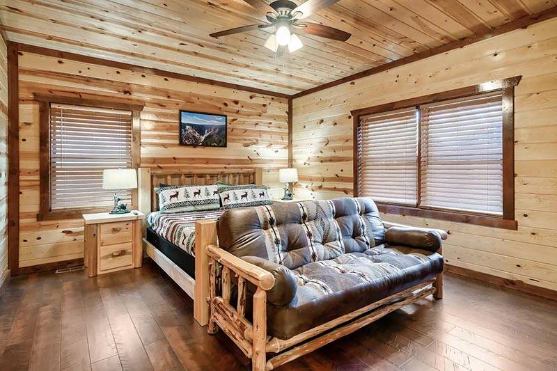3rd bedroom with seating area. at Cabin Fever Vacation in Gatlinburg TN