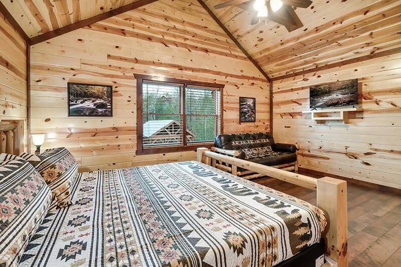 Fifth bedroom with a personal tv at your Smoky Mountains cabin. at Cabin Fever Vacation in Gatlinburg TN
