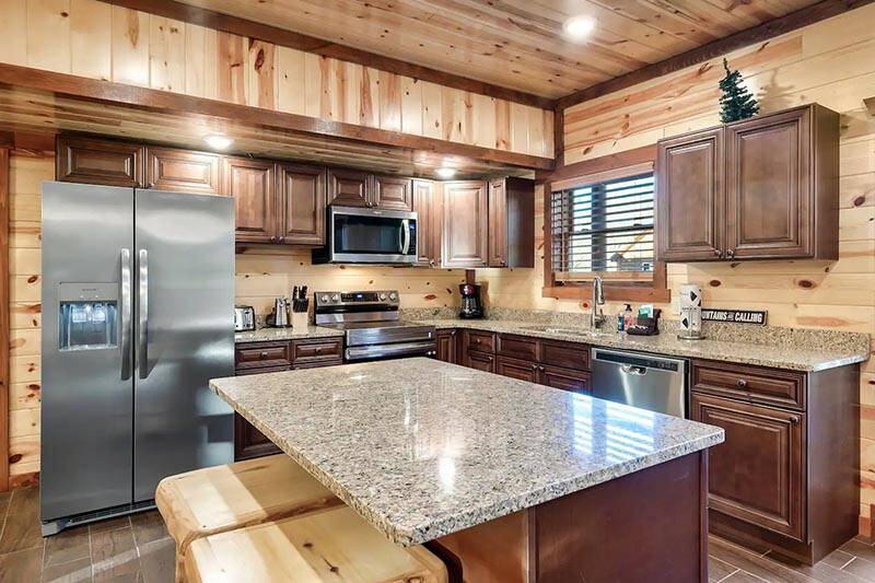 Plenty of extra seating is available at the kitchen island. at Cabin Fever Vacation in Gatlinburg TN