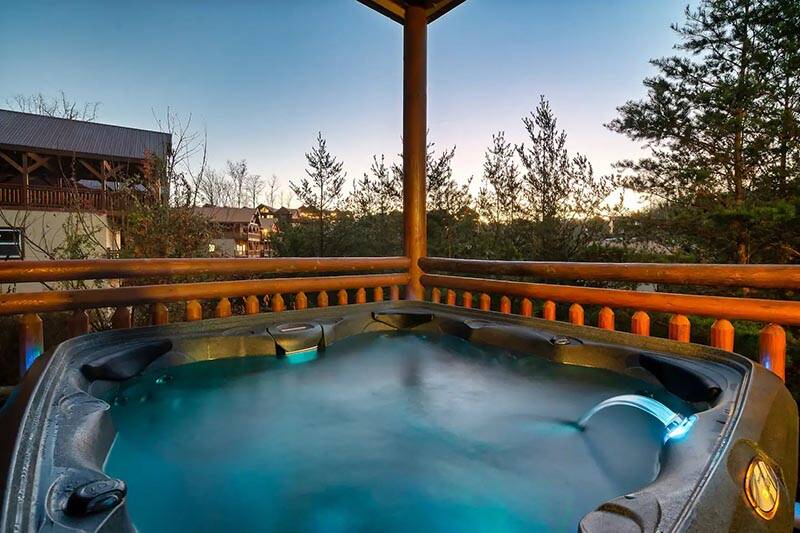 Enjoy memorable moments in this Smoky Mountains family sized hot tub. at Cabin Fever Vacation in Gatlinburg TN