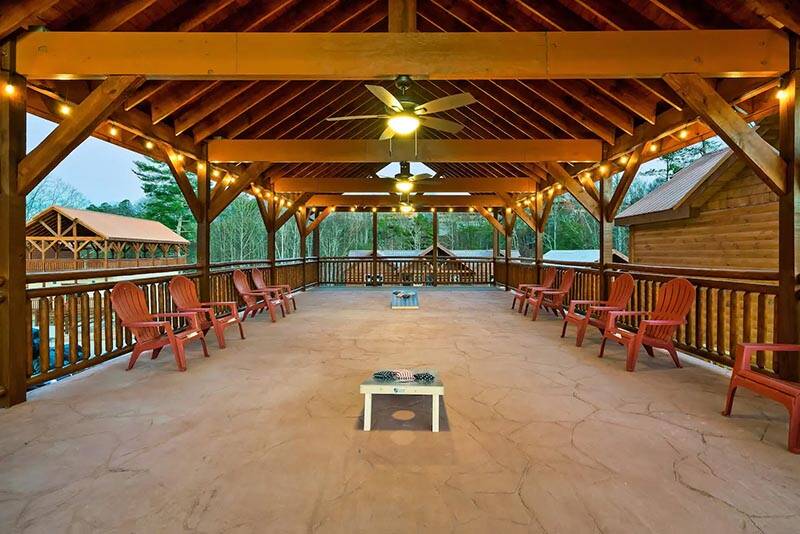 The whole family can have fun under this massive covered porch. at Cabin Fever Vacation in Gatlinburg TN